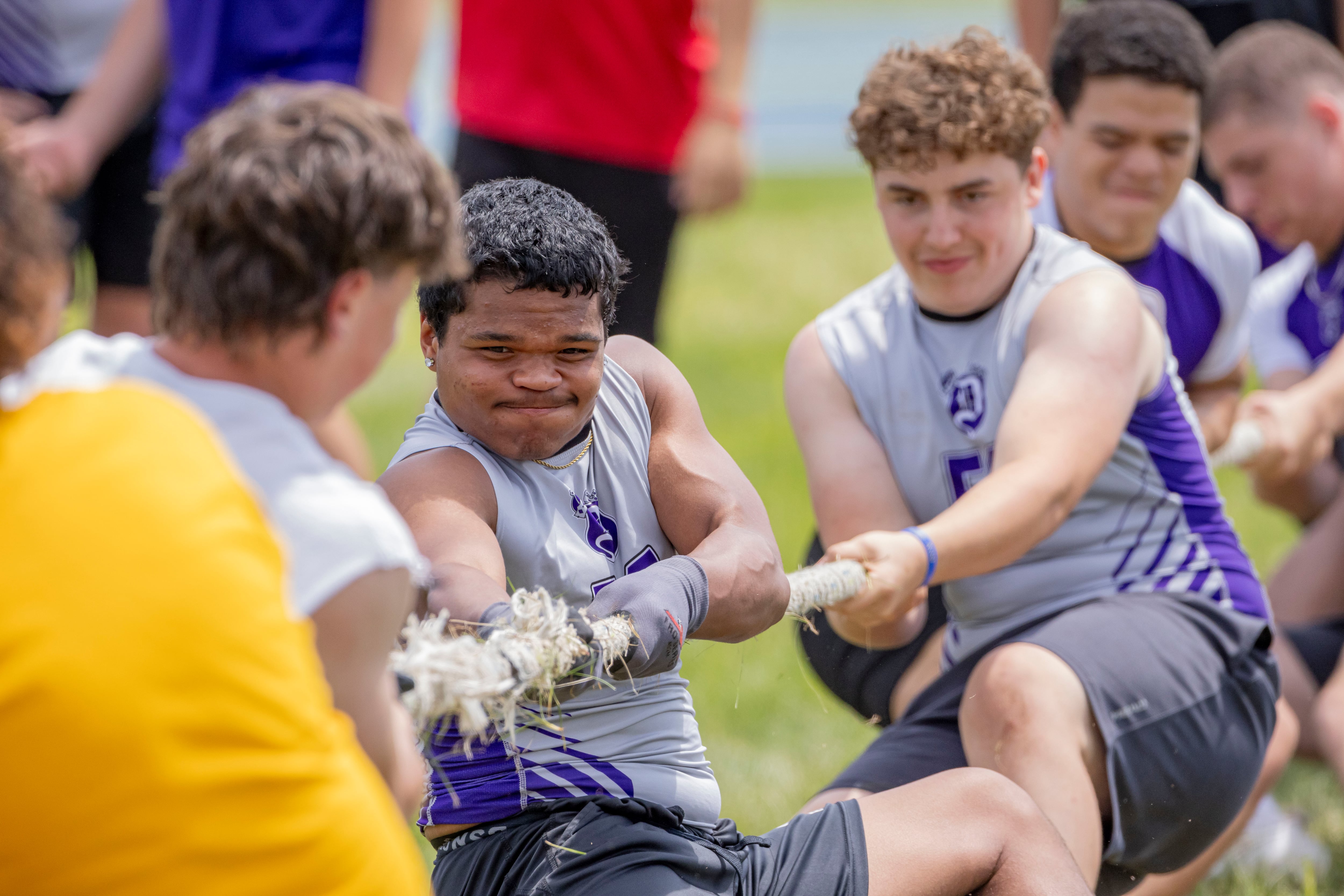 Dixon's Exzabier Diaz and teammates pull in a game of tug of war against Mendota High School during a multiple high school practice football meet at Princeton High School on July 20, 2024.