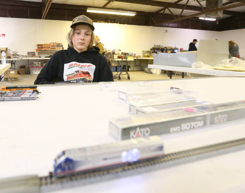 Layne Foster 15 of Wyanet, runs his N Scale Amtrak locomotive during the Model Train Fair and Farm Toy Show on Saturday, Feb. 17, 2024 at the Bureau County Fairgrounds in Princeton.