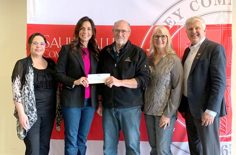 Tom Pons (center) of Erie, presented a check from the trust of his late aunt and uncle, Stan and Ruth Mitick, to Dr. Lori Cortez, left, Suzanne Ravlin, Mary Pons, and Dr. David Hellmich.