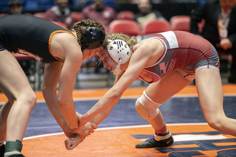 Cadence Diduch (left) of Freeport and Claudia Heeney of Lockport (right) meet in the 125-pound championship match at the IHSA Girls Wrestling State Finals on Saturday, Feb. 25, 2023, in Bloomington.