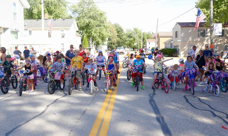 Kids get ready to participate in the Maple Park Fun Fest Bike Parade on Saturday, Sept. 2, 2023.