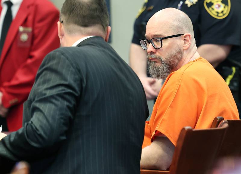 Jonathan Hurst (right) talks to his attorney Chip Criswell in Judge Marcy Buick’s courtroom at the DeKalb County Courthouse in Sycamore Monday, April 29, 2024 during a hearing on his case. Hurst is charged with murder in the August 2016 slayings of mother and son, Patricia A. Wilson, 85 and Robert J. Wilson, 64, of Sycamore.