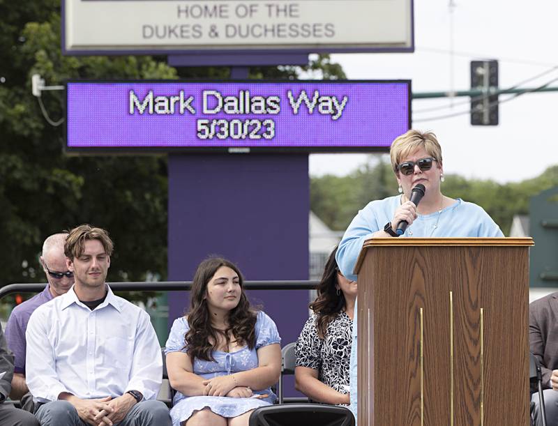 Dixon schools Superintendent Margo Empen speaks to the crowd during a ceremony naming the road in front of Dixon High School as “Mark Dallas Way” on Tuesday, May 30, 2023.