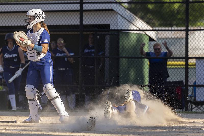 Bureau Valley’s Emily Wrights slides in safe at home against Princeton Friday, May 17, 2024 at the Class 2A regional semifinals in Rock Falls.