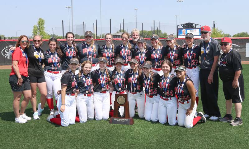 Members of the Benet Academy softball team pose with the Class 3A State third place trophy after defeating Charleston on Saturday, June 10, 2023 at the Louisville Slugger Sports Complex in Peoria.