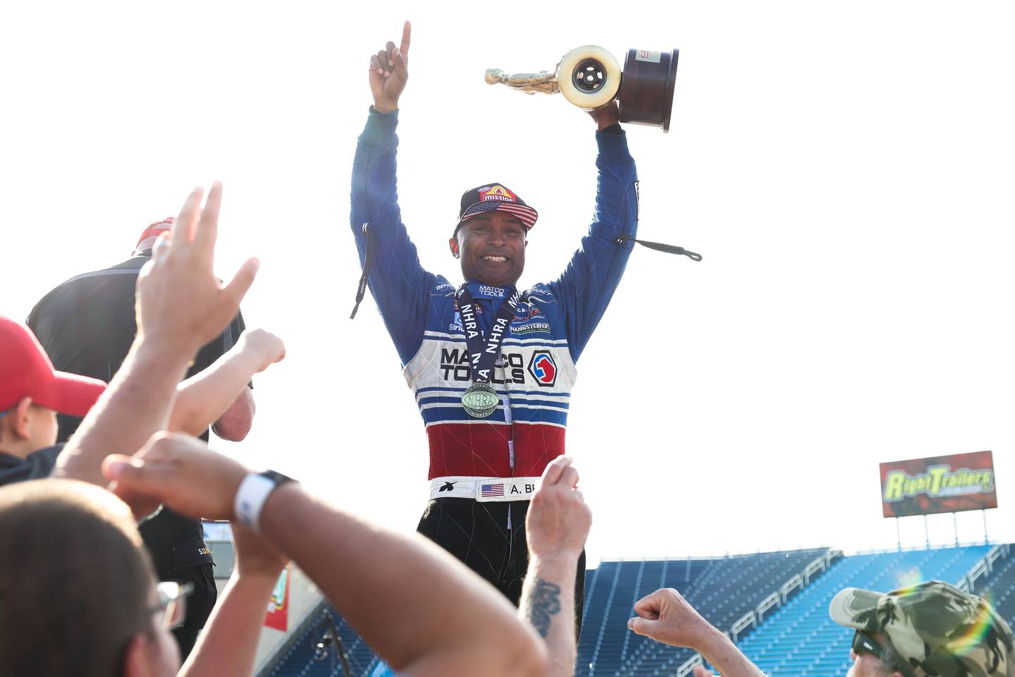 Antron Brown celebrates after winning the Top Fuel championship race at the NHRA’s Gerber Collision and Glass Route 66 Nationals at Route 66 Raceway on Sunday, May 19, 2024 in Joliet.