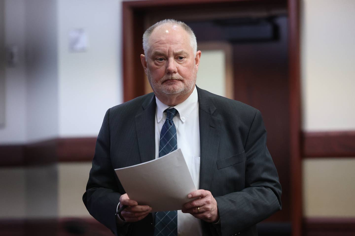 Defense attorney Jeff Tomczak for retired Joliet police sergeant Javier Esqueda prepares for a pre-trial hearing at the Kendall County courthouse on Tuesday, April 2, 2024 in Yorkville. Esqueda is charged with official misconduct for accessing and leaking the police squad video of the arrest of Eric Lurry, 37, who died following his arrest on drug charges in January 2020.