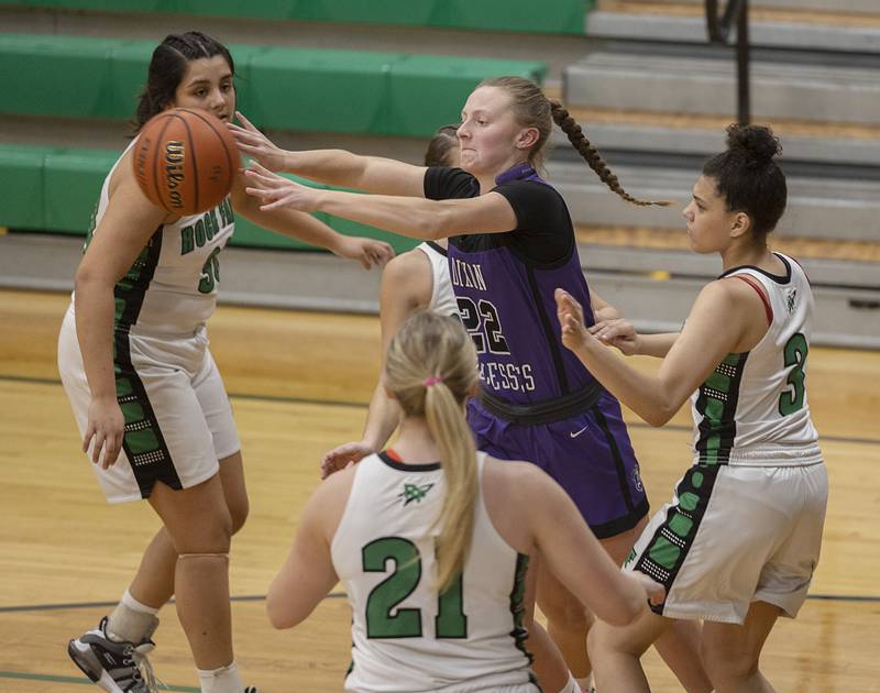 Dixon’s Katie Drew makes a pass in traffic against Rock Falls Wednesday, Jan. 31, 2024 at Rock Falls High School.