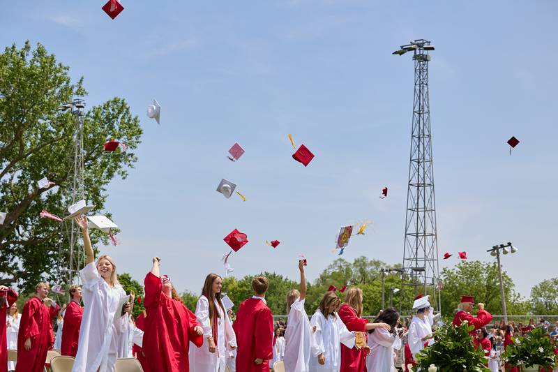 Hall High School graduates throw their caps after graduation on Saturday, May 18, 2024 at Princeton High School.