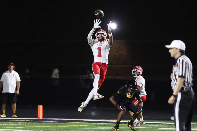 Yorkville’s Dyllan Malone goes up for the catch against Joliet West on Friday, Sept. 13, 2024 in Joliet.