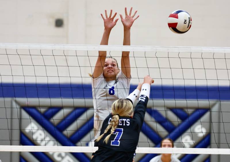 Princeton's Keighley Davis blocks Newman's Makenzie Duhon Tuesday night at Prouty Gym.