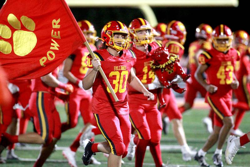 Batavia takes the field on Friday, Oct. 18, 2024 before their game against Wheaton Warrenville South in Batavia.