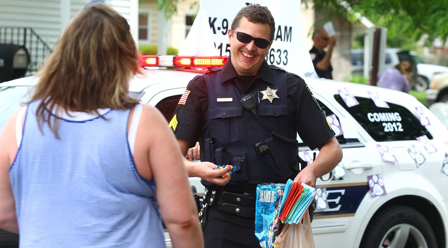 Shaw Local June 2011 file photo - 
Genoa Police Sgt. Robert Smith hands out candy during the Genoa Days parade on Saturday, June 18, 2011.