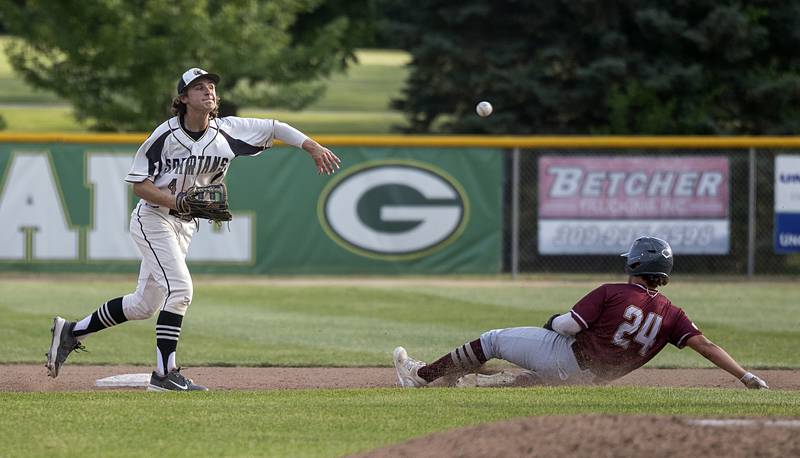 Sycamore’s Collin Severson fires to first in an attempt for the double play against Morris’ Colin Pfeifer Monday, June 3, 2024 in the Class 3A Geneseo supersectional.