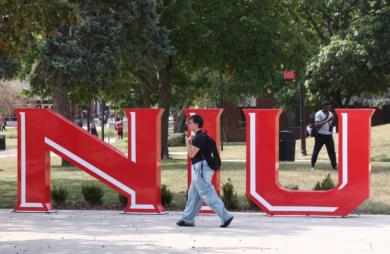 A Northern Illinois University student walks past the NIU sculpture Thursday, Sept. 12, 2024, on campus at NIU in DeKalb.