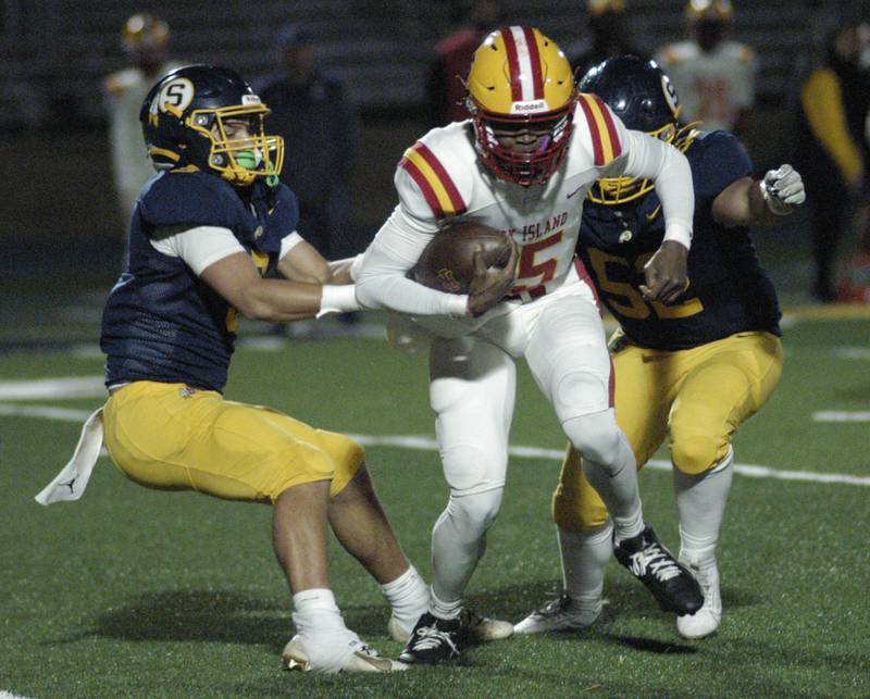 RI QB Jae'vion Clark-pugh is taken down by Sterling's Cobey Shipma with help from #52. Action took place on Friday, October  18th, 2024 in Sterling.