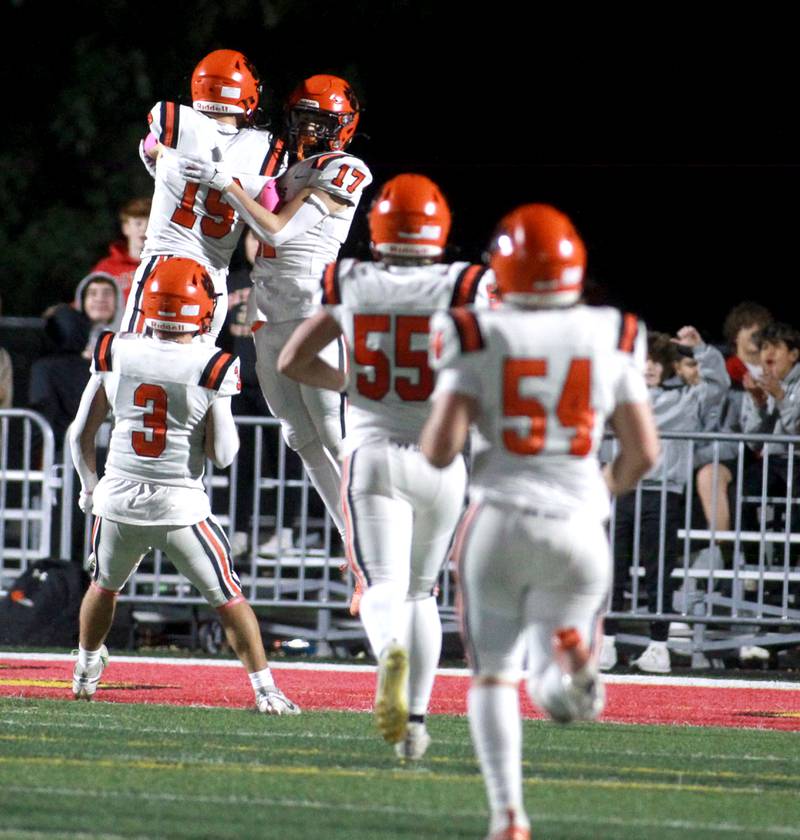 Wheaton Warrenville South’s Brody Keith (left) and Luke Beres celebrate Beres’ touchdown on Friday, Oct. 18, 2024 during a game at Batavia.