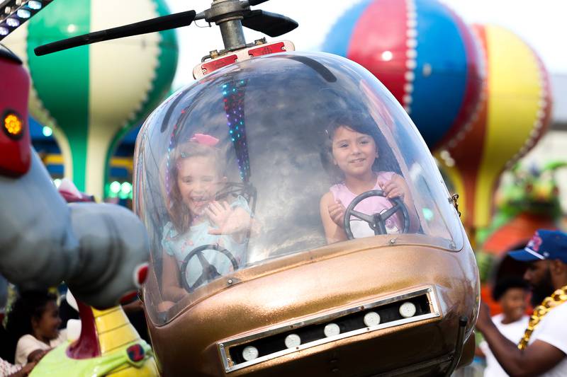 Maleyna Tomish, and Siena fly the helicopter ride at the Taste of Joliet on Saturday, June 22, 2024 at Joliet Memorial Stadium.