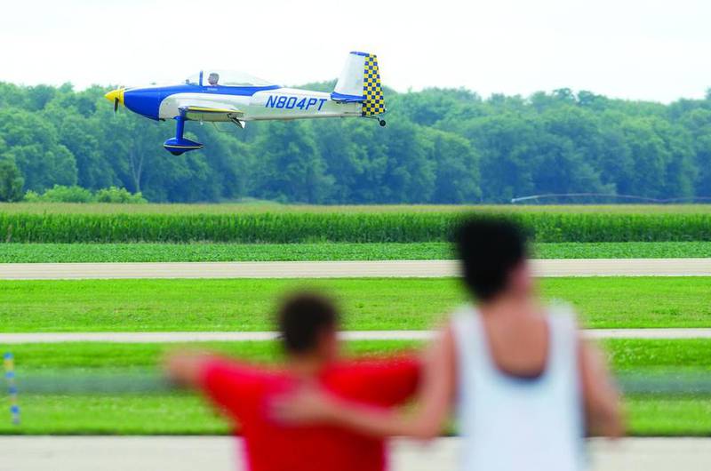 A Van's RV6/6A single-engine aircraft comes in for a landing Saturday morning at the Whiteside County Airport. A large group of pilots used the airport to practice flying in formation for the upcoming Experimental Aircraft Association Fly-In in Oshkosh Wisconsin.