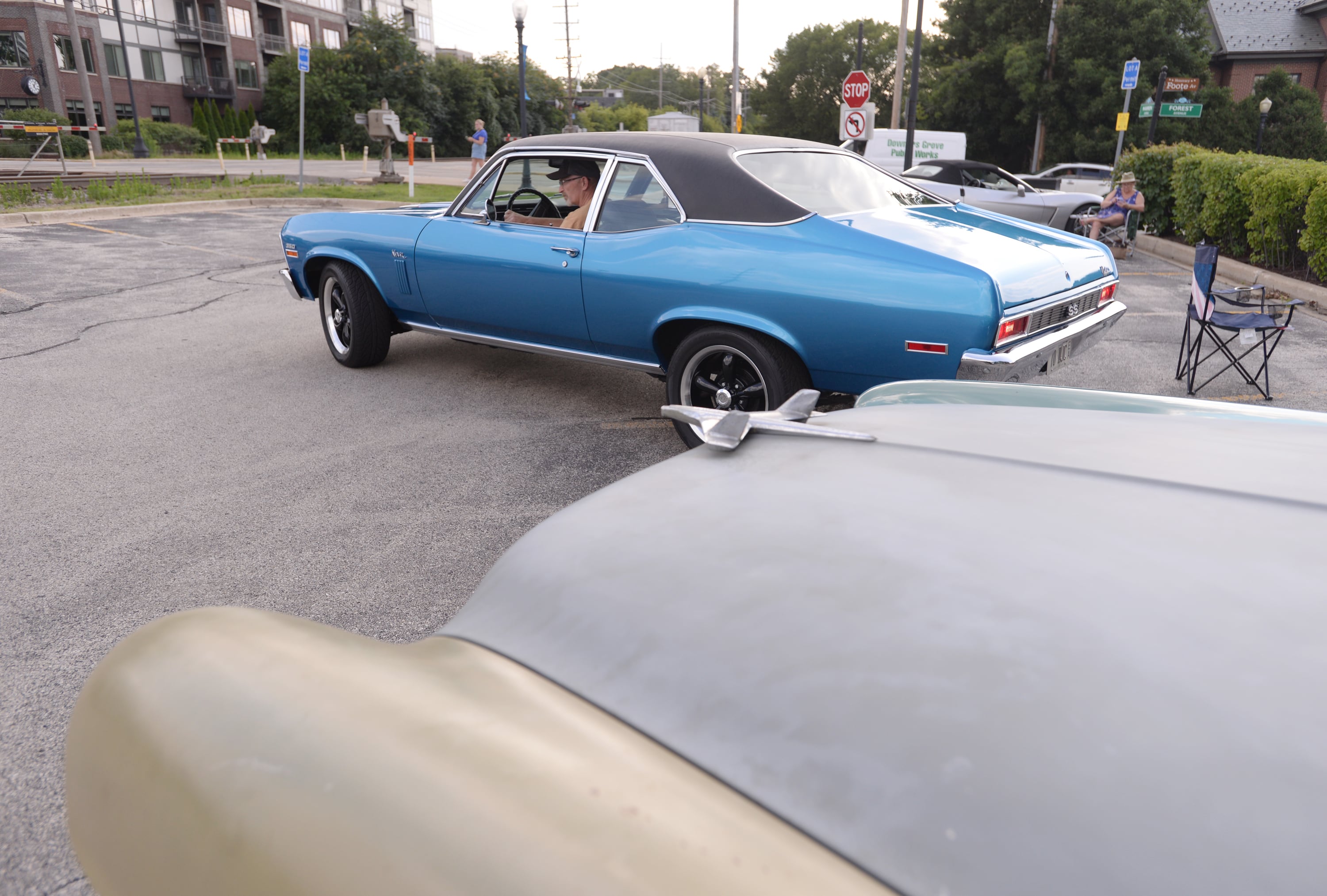 Don Collins of Downers Grove pulls his 1970 Chevy Nova into the Downers Grove Car Show Friday July 19, 2024.