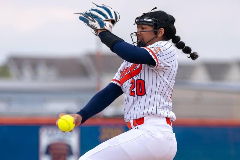 Oswego’s Jaelynn Anthony (20) delivers a pitch against Yorkville during a softball game at Oswego High School on Tuesday, April 25, 2023.
