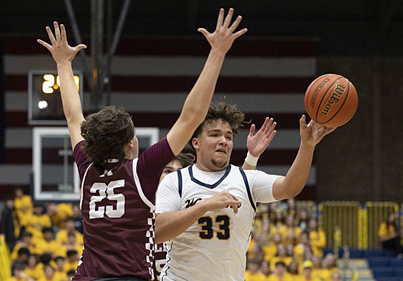 Sterling’s Maddux Osborn makes a pass against Moline’s Peyton Olmstead Friday, Dec. 1, 2023 in Sterling.