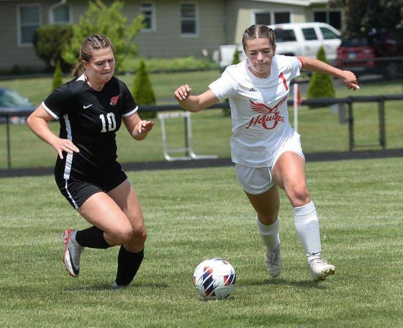 Oregon's Mya Engelkes (1) and Stillman Valley's Olivia Voltz run down a loose ball during the 1A Indian Creek Sectional on Saturday, May 18, 2024. Stillman Valley won the game 2-1 to advance to the sectional championship.