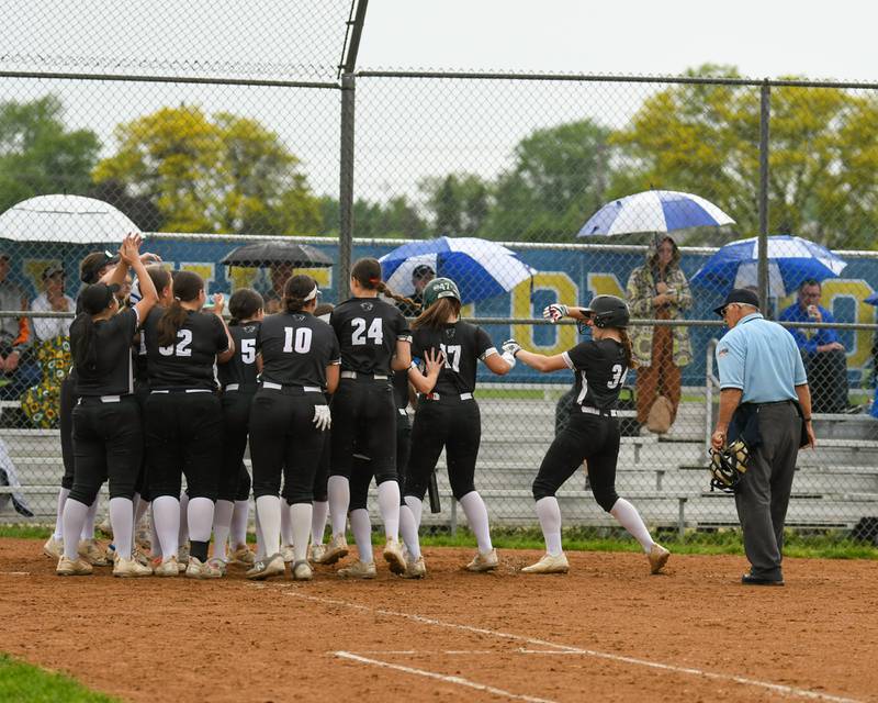 Glenbard North's Tru Medina (34) celebrates as she runs home after hitting a home run during the game on Monday May 13, 2024, while traveling to take on Wheaton North High School.