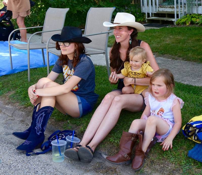 Lorelai, Jolie, Remi and Piper Pettit, of Utica, watch the Maple Park Fun Fest Parade on Saturday, Sept. 2, 2023.