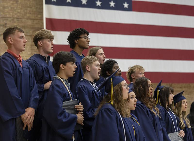 Sterling High School senior choir members sing the national anthem Friday, May 24, 2024 at the start of graduation.