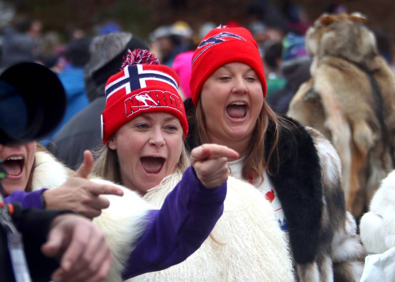 People greet jumpers during the 119th Norge Annual Winter Ski Jump Tournament in Fox River Grove Sunday.