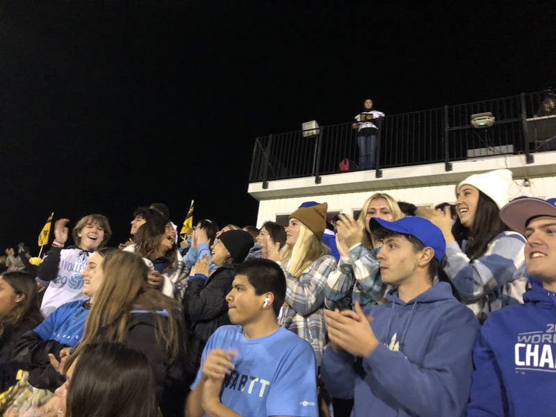 The Harvard student section wears blue Friday night to honor classmate Jack Ellis, who passed away earlier this week.