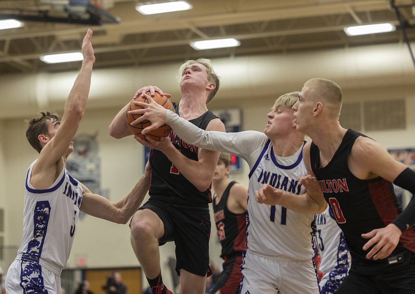 Fulton’s Trevor Tiesman is fouled by Pecatonica’s Drew Williams during a class 1A sectional semifinal Wednesday, Feb. 28, 2024 at River Ridge High School.