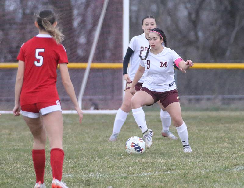 Morris' Kendra Vasquez looks to pass the ball away from Streator's Alyssa Arambula on Monday, March 25, 2024 at the James Street Recreation Area in Streator.