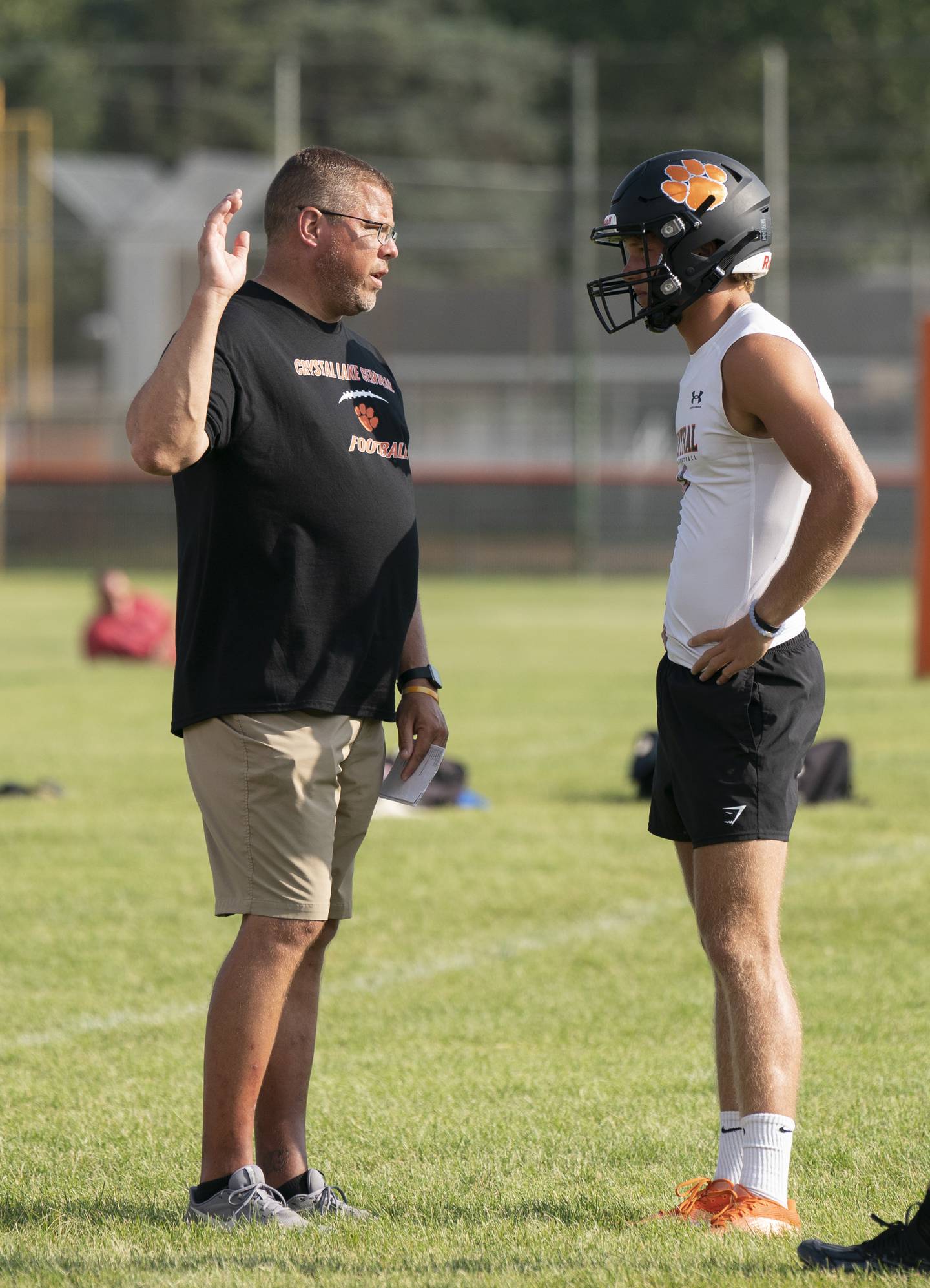 Crystal Lake Central head coach Dirk Stanger talks with quaterback Jason Penza during a 7 on 7 football practice held on Thursday, July 21, 2022 at Crystal Lake Central High School. Ryan Rayburn for Shaw Local