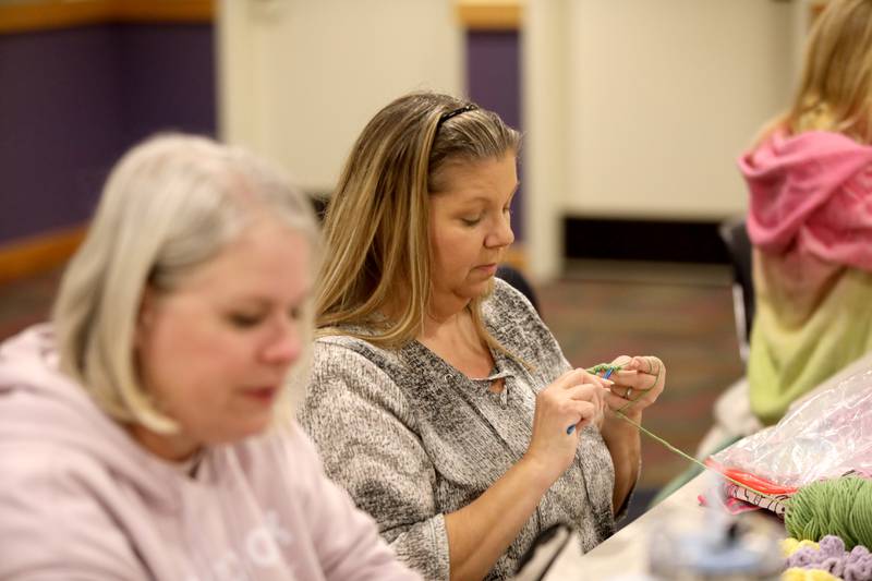 Nancy Kick (left) of Plano and Lucy Gardner of Sandwich work on a crochet project during a session of the Knit and Crochet Group at the Plano Community Library District.