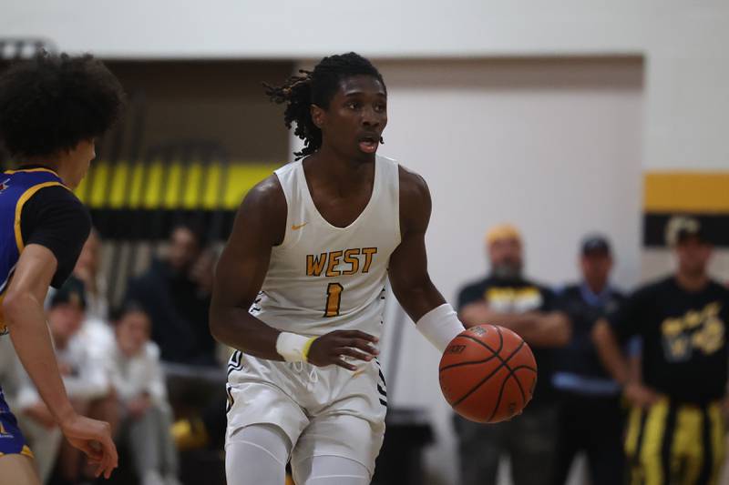 Joliet West’s Justus McNair works the ball upcourt against Joliet Central on Tuesday, Nov. 28, 2023 in Joliet.