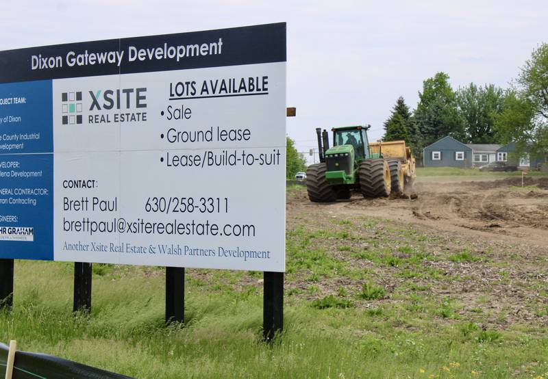 Tractors pulling scrapers begin grade-leveling the property adjacent to Keul Road in Dixon that is part of the Gateway Development site on Tuesday.