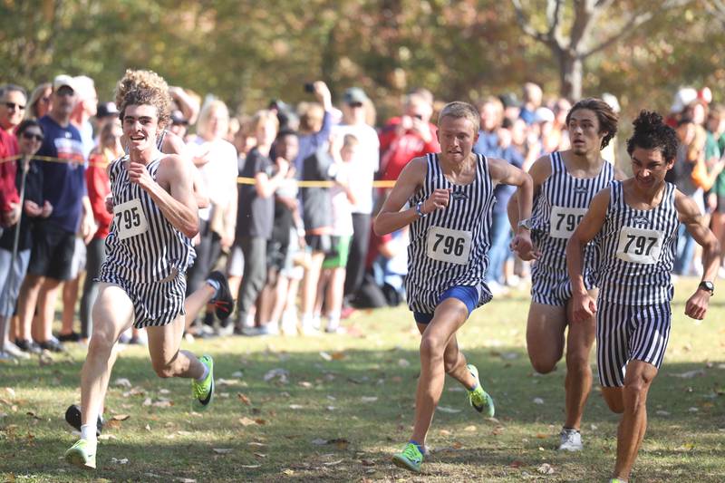 Plainfield South runners finish as a group taking 7th though 11th for a first place team finish in the Boys Cross Country Class 3A Minooka Regional at Channahon Community Park on Saturday.