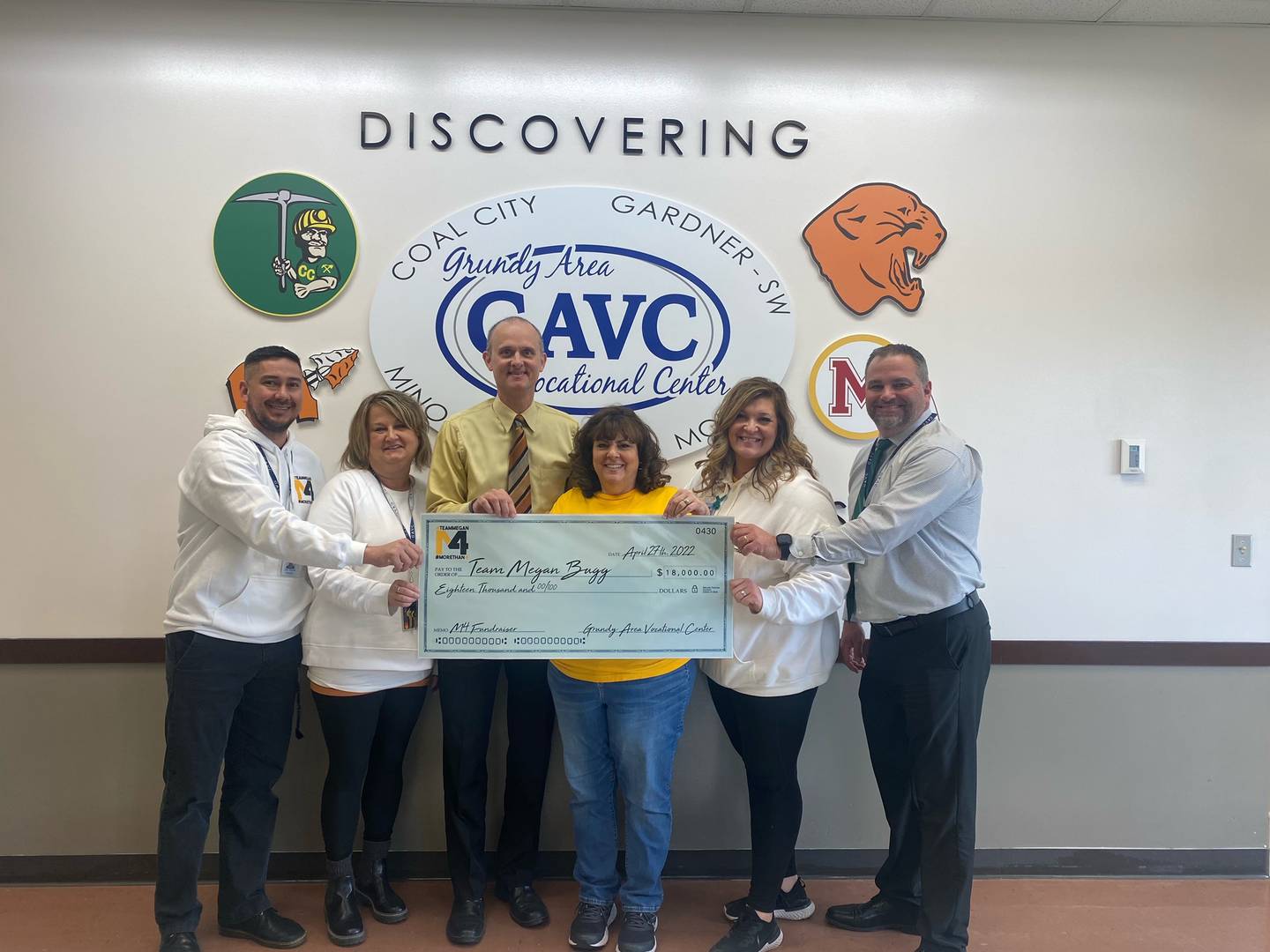 The Grundy County Vocational Center presented Kent and Deborah Bugg a check for $18,000 in honor of their daughter Megan Bugg on Wednesday.