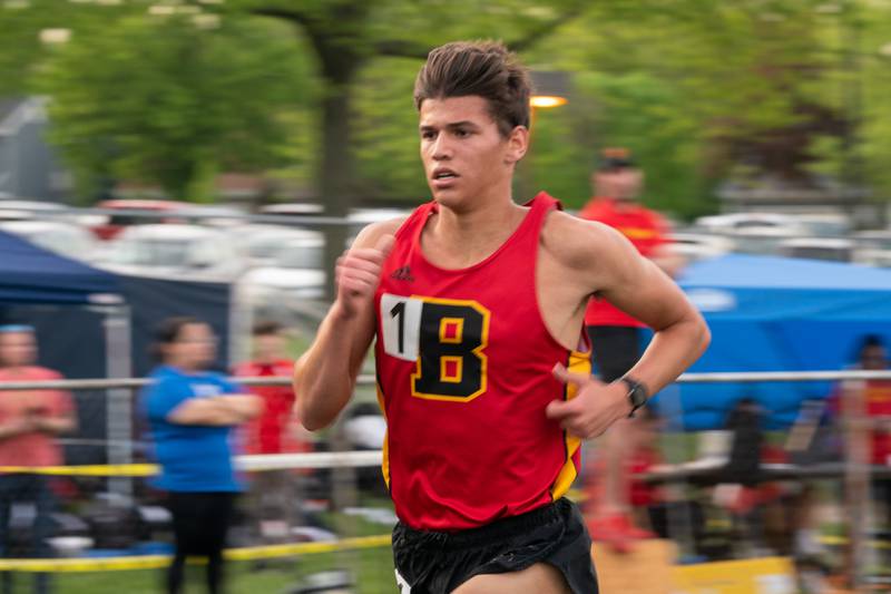 Batavia’s Quintin Lowe competes in the 3200 meter run during a DuKane Conference boys track and field meet at Geneva High School on Thursday, May 11, 2023.
