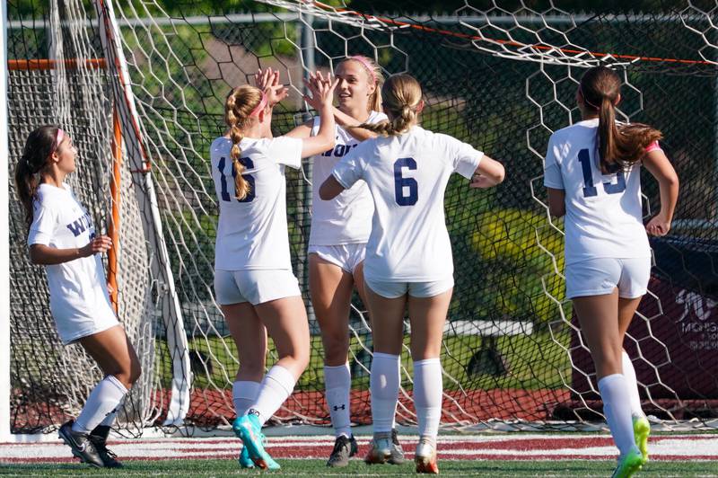 Oswego’s Gillian Young (center) celebrates after scoring a goal on a penalty kick against Oswego during a Class 3A Lockport Regional semifinal soccer match at Lockport High School in Lockport on Wednesday, May 15, 2024.