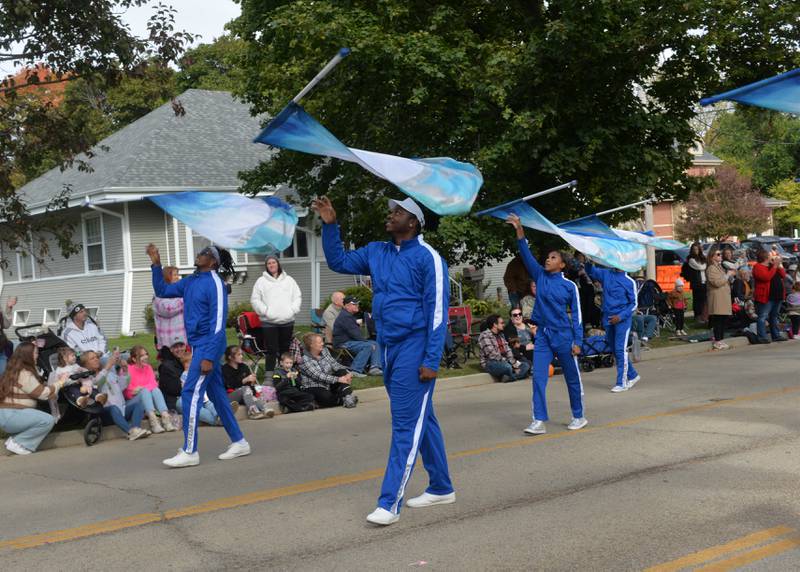 Members of the South Shore Drill Team of Chicago strike a pose as they perform in the Harvest Time Parade, held during Oregon's Autumn on Parade festival on Sunday, Oct. 8, 2023.