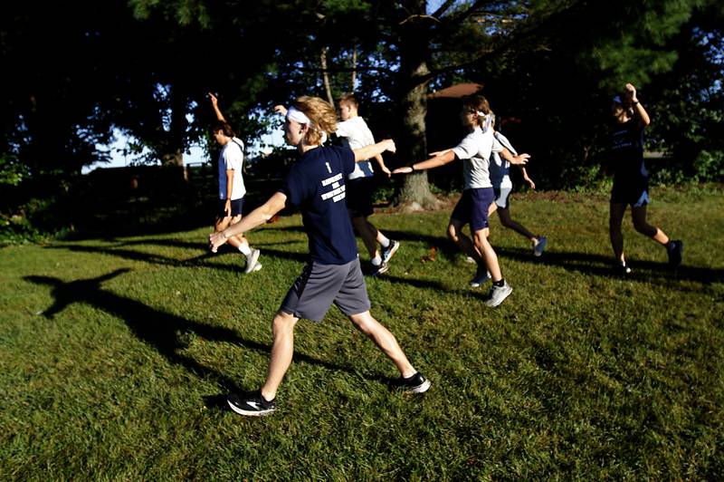 Cary-Grove runners warm up before the boys race of the McHenry County Cross Country Invite on Saturday, August 31, 2024, at McHenry Township Park in Johnsburg.