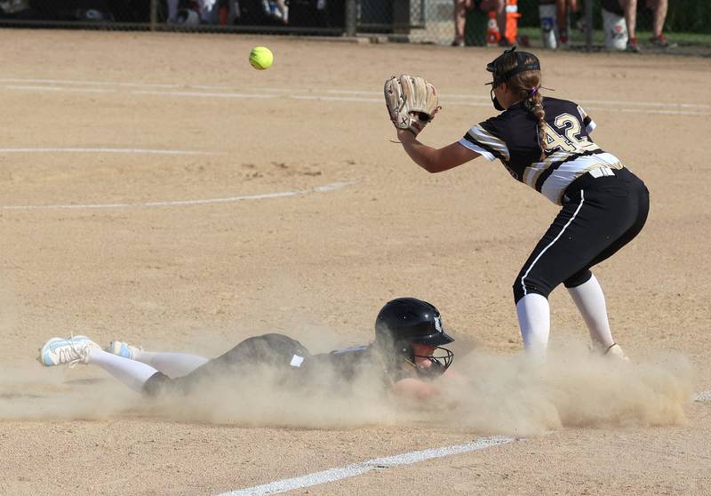 Prairie Ridge's Adysen Kiddy gets in just ahead of the tag of Sycamore's Addison Armstrong during their Class 3A sectional final Friday, May 31, 2024, at Sycamore High School.