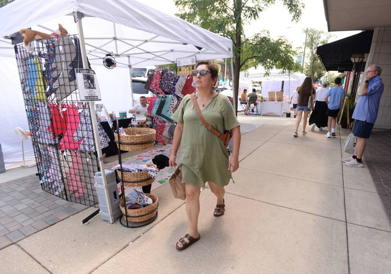 People including Lupe Fonseca of Darien attend the LaGrange Craft Fair held Saturday, July 13, 2024.