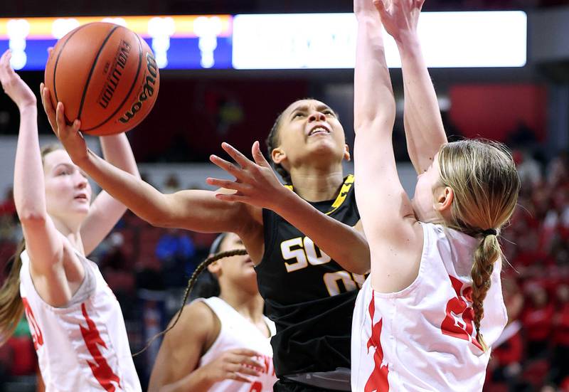 Hinsdale South's Hailey Goins shoots around Glenwood's Makaela Diamond during their game Friday, March 1, 2024, in the IHSA Class 3A state semifinal at the CEFCU Arena at Illinois State University in Normal.
