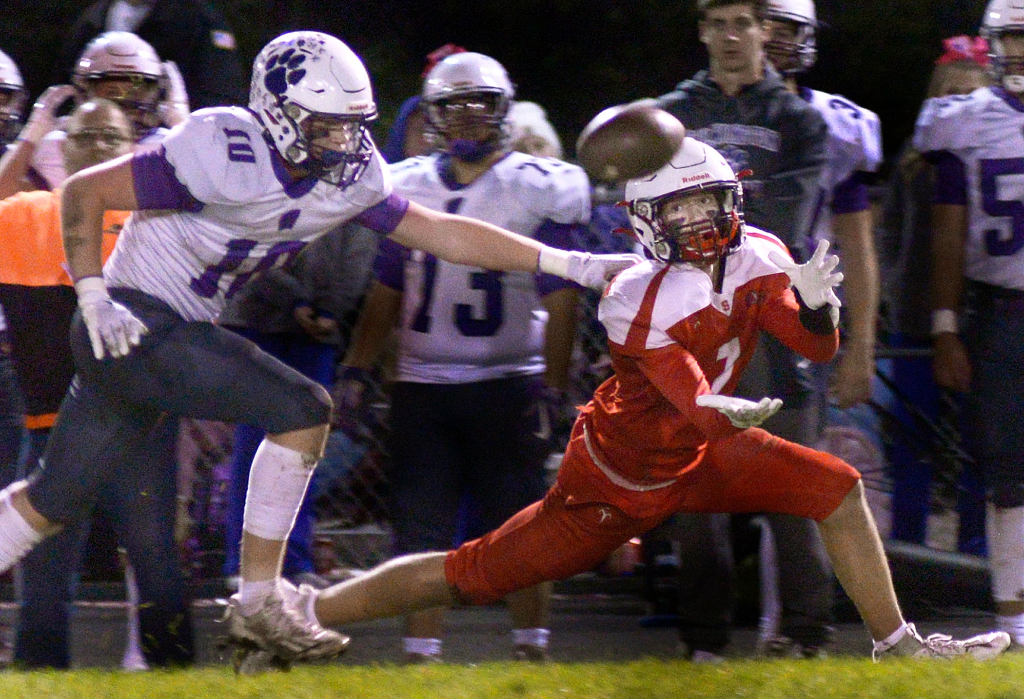 Streator’s Matt Williamson (7) extends to haul in a pass as Wilmington’s Reid Juster (10) defends Friday, Oct. 20., 2023, in Streator.