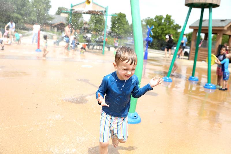 Matthew Molski, 5, runs through the water at the Maryknoll Splash Park in Glen Ellyn on Saturday, June 15, 2024.