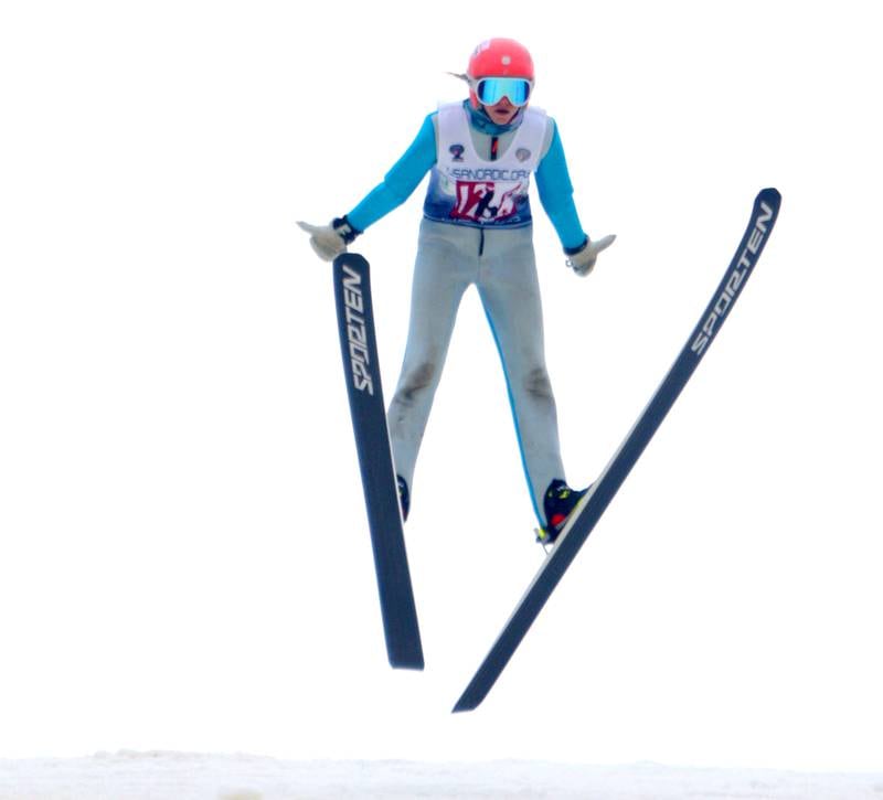 McKenzie Maines of Team SSWSC soars during the 119th Norge Annual Winter Ski Jump Tournament in Fox River Grove Sunday.